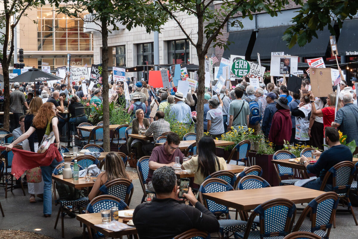 Good Trouble protesters march past downtown restaurant