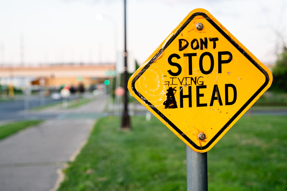 Graffiti on a Stop Ahead sign in Minneapolis