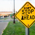 Graffiti on a Stop Ahead sign in Minneapolis