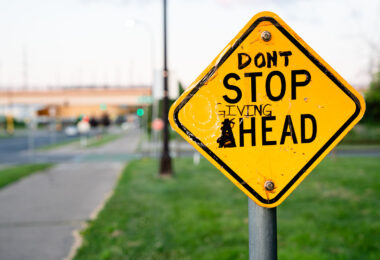 Graffiti on a Stop Ahead sign in South Minneapolis.