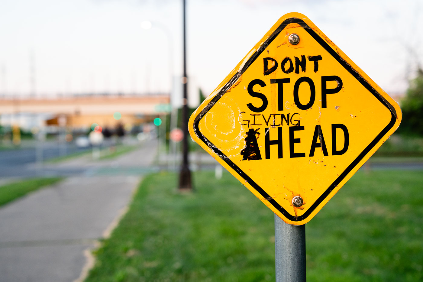 Graffiti on a Stop Ahead sign in Minneapolis
