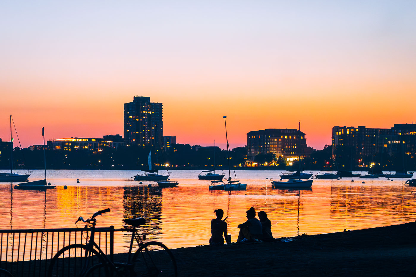 Group watches sunset at a Minneapolis beach
