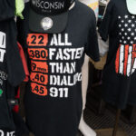 I stand for the flag Wisconsin Dells shirts 1 Shirts being sold in Wisconsin Dells in July 2025.