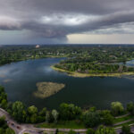 A large thunderstorm rolling in over Lake of the Isles in Minneapolis in July 2025.