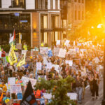 Sunset and Good Trouble Protesters in Downtown Minneapolis 1 Protesters in Downtown Minneapolis as part of nationwide “Good trouble lives on” protests.Organizers say “Good Trouble Lives On is a national day of action to respond to the attacks on our civil and human rights by the Trump administration. Together, we’ll remind them that in America, the power lies with the people.”After gathering at the Hennepin County Government Center listening to speakers such as Toussaint Morrison, Nekima Levy Armstrong, and Lieutenant Governor Peggy Flanagan they marched through Downtown Minneapolis.