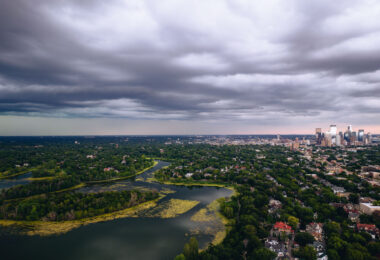 Large thunderstorms move in during a weather warning over Lake of the Isles. Downtown Minneapolis visible.