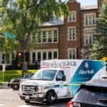 An ambulance at Annunciation Catholic School and church in Minneapolis on August 27, 2025 following a mass shooting that killed 2 children and injured 17 others, 14 of them children.