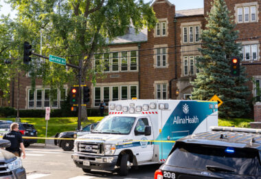 An ambulance at Annunciation Catholic School and church in Minneapolis on August 27, 2025 following a mass shooting that killed 2 children and injured 17 others, 14 of them children.