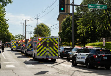 Police at Annunciation Catholic School in Minneapolis on August 27, 2025 following a mass shooting that killed 2 children and injured 17 others, 14 of them children.