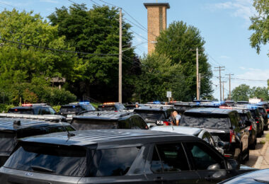 Police at Annunciation Catholic School in Minneapolis on August 27, 2025 following a mass shooting that killed 2 children and injured 17 others, 14 of them children.