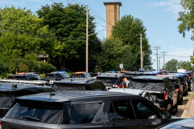 Police at Annunciation Catholic School in Minneapolis on August 27, 2025 following a mass shooting that killed 2 children and injured 17 others, 14 of them children.