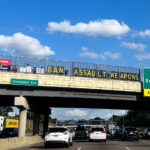 "BAN ASSAULT WEAPONS" seen above I-94 between Minneapolis and St. Paul.