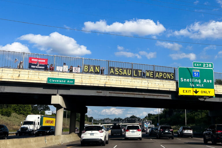 BAN ASSAULT WEAPONS banner on I-94 1 "BAN ASSAULT WEAPONS" seen above I-94 between Minneapolis and St. Paul.