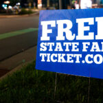 Yard signs giving away Minnesota State Fair tickets. There's a catch: the tickets given away by Creative Church in Maple Grove, require you to attend a church service first.