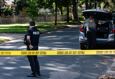 Police at Annunciation Catholic School and Church in Minneapolis on August 27, 2025 following a mass shooting that killed 2 children and injured 17 others, 14 of them children.
