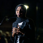 MN US Representative Ilhan Omar at vigil 1 The Minneapolis community gathered at Lynnhurst Park last night for a vigil following the mass shooting at Annunciation School and Church earlier in the morning. 2 children were killed and 17 others injured. The crowd heard from speakers ranging from the Minnesota Attorney General, Minneapolis Mayor and City Council Members, and Congresswomen.