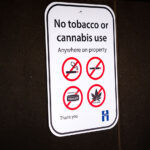 A "no tobacco or cannabis use Anywhere on property" sign at a Hennepin County Library.