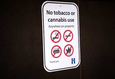 A "no tobacco or cannabis use Anywhere on property" sign at a Hennepin County Library.