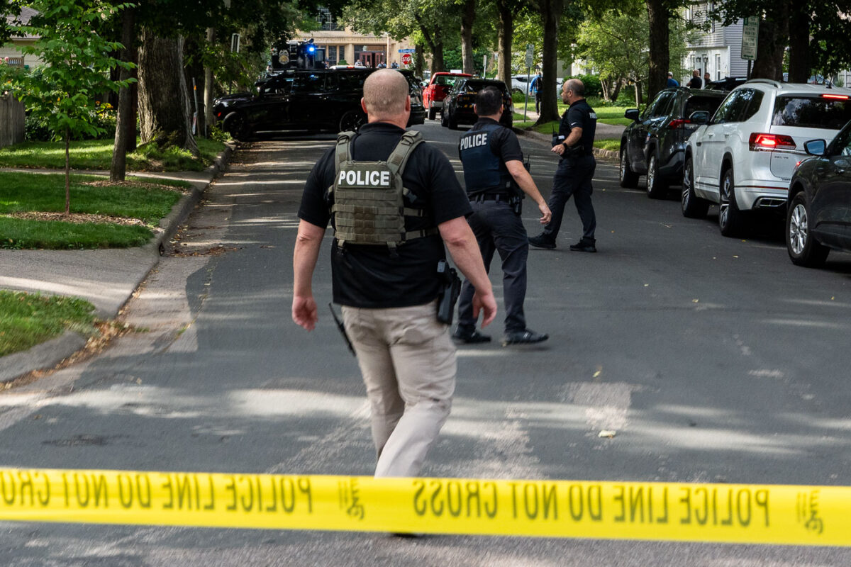 Police at Annunciation Catholic School and Church in Minneapolis on August 27, 2025 following a mass shooting that killed 2 children and injured 17 others, 14 of them children.