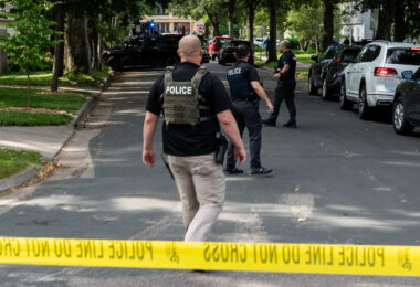 Police at Annunciation Catholic School and Church in Minneapolis on August 27, 2025 following a mass shooting that killed 2 children and injured 17 others, 14 of them children.