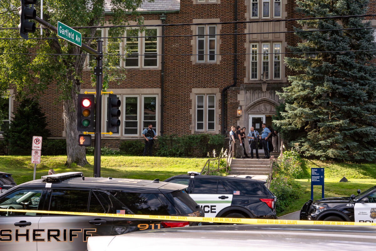 Police at Annunciation Catholic School in Minneapolis on August 27, 2025 following a mass shooting that killed 2 children and injured 17 others, 14 of them children.