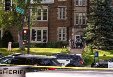 Police at Annunciation Catholic School in Minneapolis on August 27, 2025 following a mass shooting that killed 2 children and injured 17 others, 14 of them children.