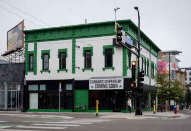 A banner reading "Cannabis Dispensery[sic] Coming Soon" at the long time Juut hair salon that's been vacant for a few years.