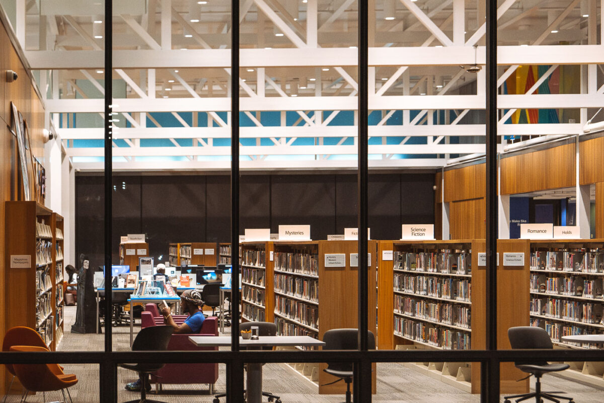 A man reading inside the Walker Library on Hennepin Avenue in Uptown Minneapolis.