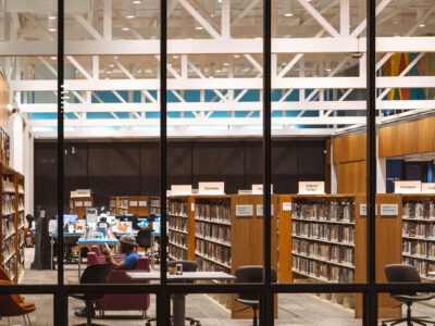 Man reading inside Walker Library, Hennepin Ave, Uptown Minneapolis