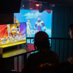 Club goers play video games at Sexy Nerds event in Uptown Minneapolis in September 2025.