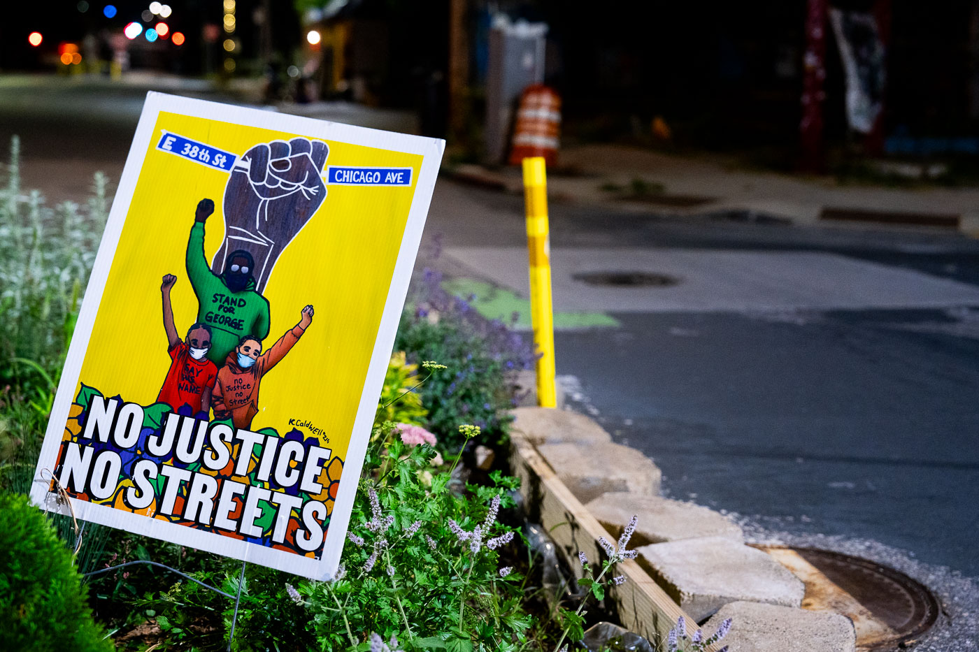 A "No Justice No Streets" yard sign in the middle of Chicago Avenue and East 38th Street at George Floyd Square.The area continues to be a place of protest since the May 2020 murder of George Floyd.