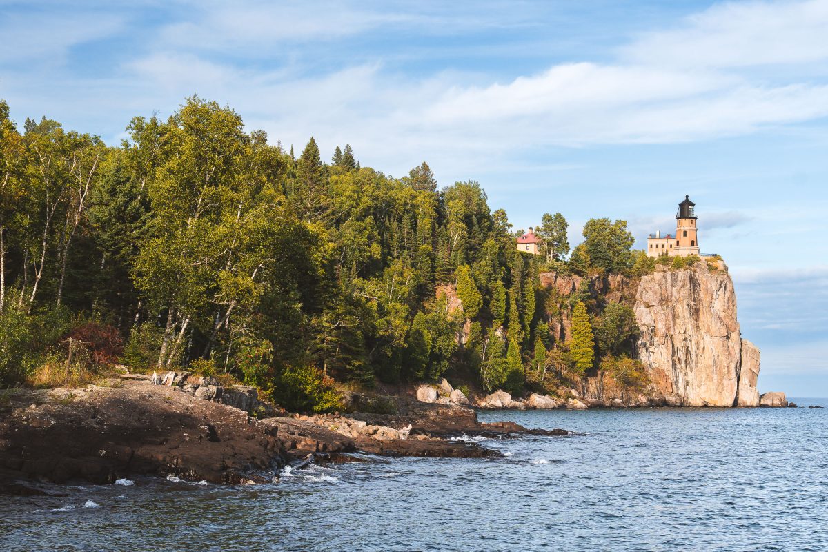 Split Rock Lighthouse Above a Forested Shoreline on Lake Superior