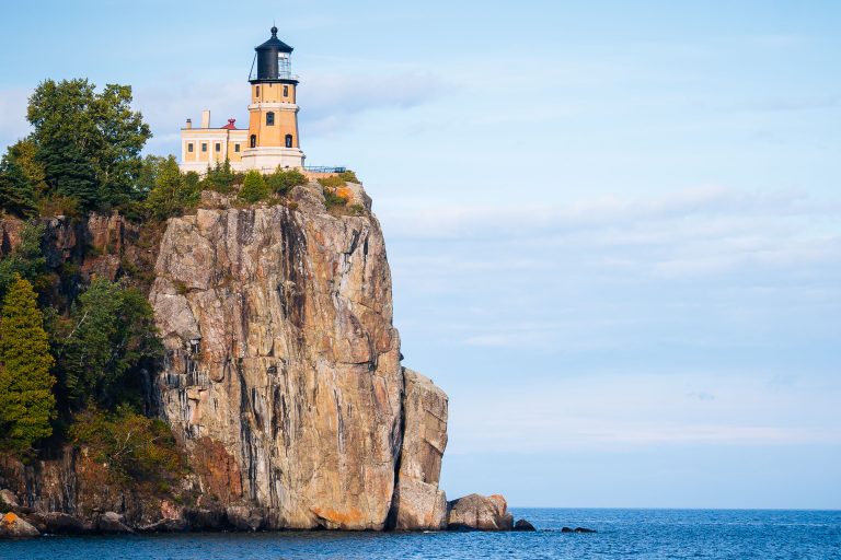Split Rock Lighthouse stands on a rocky cliff above Lake Superior in Minnesota.