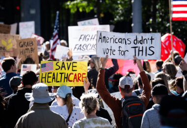 Protester holding a sign up that reads "Americans didn't vote for this".

Thousands protest in Downtown Minneapolis on Saturday October 18, 2025 as part of nationwide “No Kings!” protest.