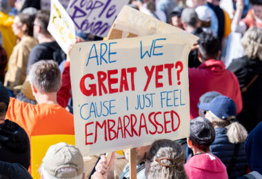 "Are we great yet? Cause I just feel embarassed" protest sign.

Thousands protest in Downtown Minneapolis on Saturday October 18, 2025 as part of nationwide “No Kings!” protest.