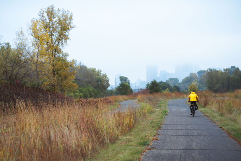 Autumn morning on the Cedar Lake Trail in Minneapolis 2 Biking towards Downtown Minneapolis on a autumn morning, a foggy haze covers the tops of the buildings.