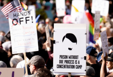 Protest sign that reads "Prison Without Due Process Is A Concentration Camp".

Thousands protest in Downtown Minneapolis on Saturday October 18, 2025 as part of nationwide “No Kings!” protest. Organizers say 100,000 attended.