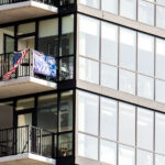 This was the only "counter protester" i saw today at No Kings Minneapolis. Someone hanging an American Flag and a "2024 Trump Vance" flag from their 15-20th floor condo across from US Bank Stadium.Thousands protest in Downtown Minneapolis on Saturday October 18, 2025 as part of nationwide “No Kings!” protest.