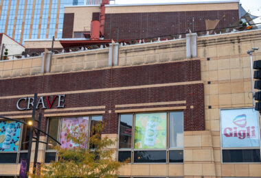 Ads for Gigli THC Drinks in the windows of a downtown Minneapolis office building. Seen on Hennepin Avenue in October 2025.