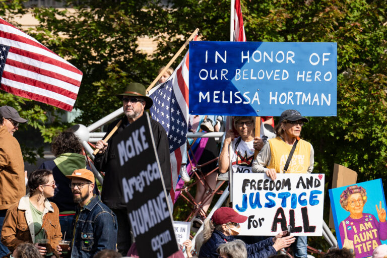 In Honor Of Our Beloved Hero Melissa Hortman No Kings 2 Protesters holding signs that read "In Honor of Our Beloved Hero Melissa Hortman" and "Freedom and Justice For All".Thousands protest in Downtown Minneapolis on Saturday October 18, 2025 as part of nationwide “No Kings!” protest.