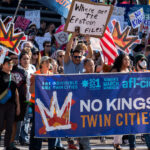 Minnesota Attorney General Keith Ellison holding the banner and marching at No Kings in Downtown Minneapolis.

Thousands protest in Downtown Minneapolis on Saturday October 18, 2025 as part of nationwide “No Kings!” protest.