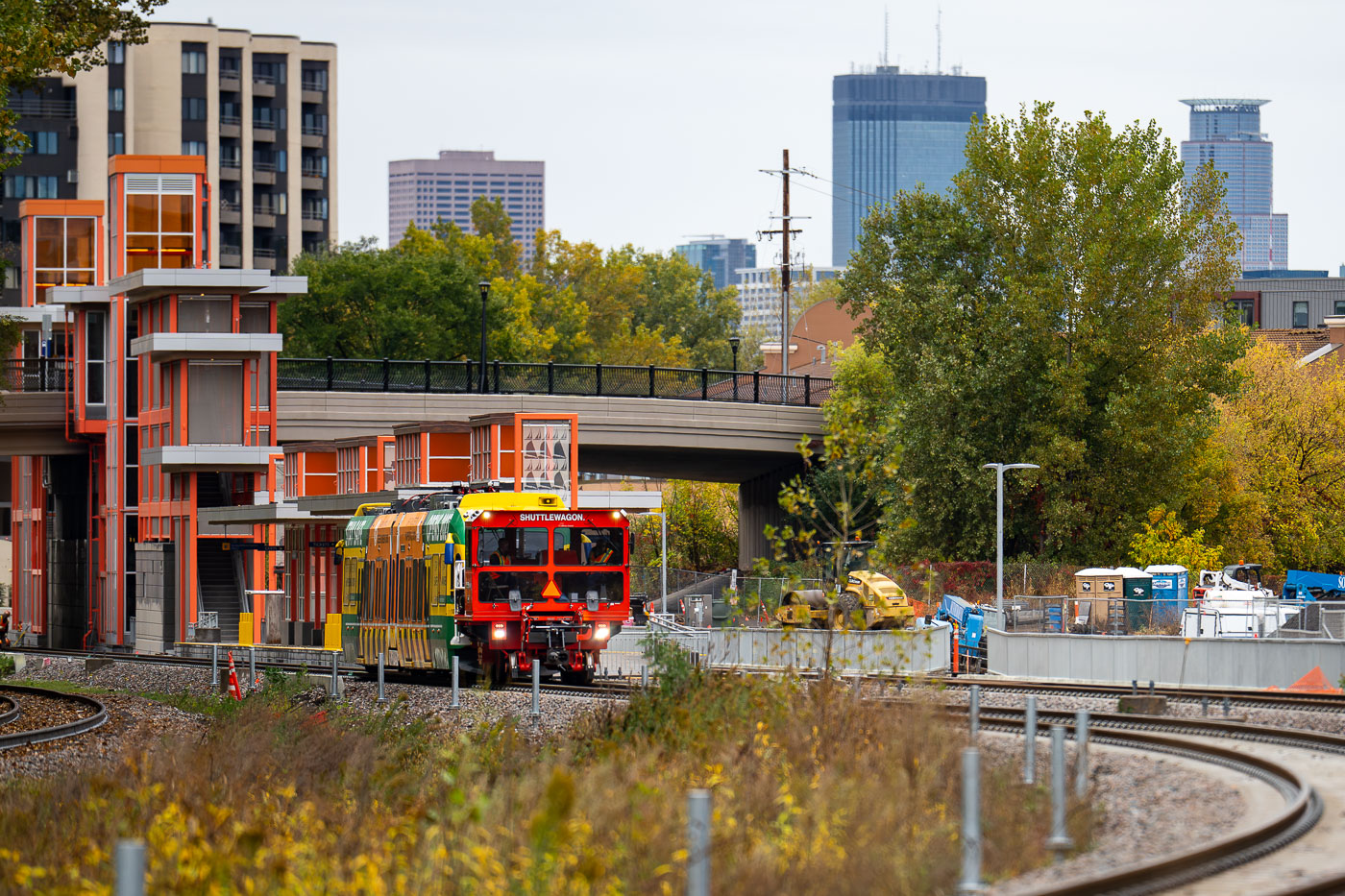 Light rail vehicle leaves W Lake St Station for first time