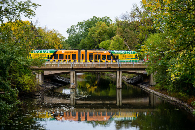Light rail vehicle on the bridge at the Kenilworth Channel 1 Light rail vehicle on the bridge at the Kenilworth Channel. This morning Metro Transit towed a light rail vehicle through the line for the first time doing basic clearance testing. Construction on the green line extension began in 2018 and is set to open to passengers in 2027.