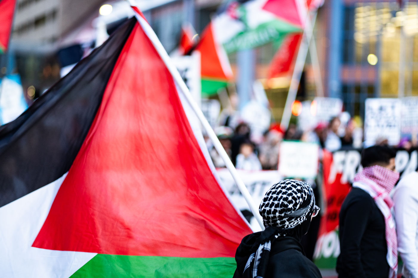 Man with palestine flag in downtown Minneapolis