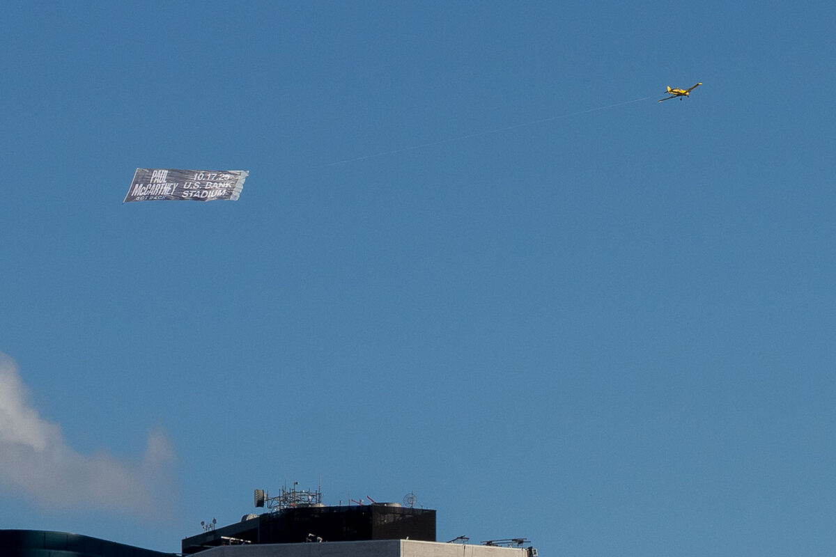 Paul McCartney banner flying around Minneapolis