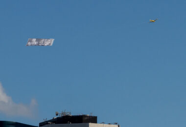 A banner advertising Paul McCartney at US Bank Stadium flying around Minneapolis 1 hour before doors open.