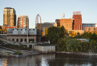 The Pillsbury A-Mill, completed in 1881 on the east bank of the Mississippi River, was once the largest flour mill in the world and a symbol of Minneapolis’s dominance in global grain production. Designed by architect LeRoy Buffington and engineer William de la Barre, the mill harnessed the power of St. Anthony Falls to grind over 5,000 barrels of flour a day at its peak. Its innovative use of water turbines, reinforced limestone walls, and massive storage elevators represented the cutting edge of 19th-century milling technology. Today, the restored complex — now repurposed as artist lofts — stands as a National Historic Landmark and a reminder of the city’s industrial ingenuity.
