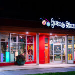 The Spectacle Shoppe on Hennepin Avenue in Uptown Minneapolis with new grass and bike lane installed. The multi year project to rebuild Hennepin Avenue comes to an end next month.