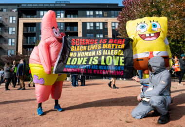 Protesters with Spongebob Squarepants costumes holding a banner thart reads "Science is real, Black Lives Matter, No human is illegal, love is love, women's rights are human rights, kindness is everything."

Thousands protest in Downtown Minneapolis on Saturday October 18, 2025 as part of nationwide “No Kings!” protest.