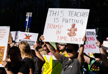 "This teacher is putting trump in a time out" protest sign.

Thousands protest in Downtown Minneapolis on Saturday October 18, 2025 as part of nationwide “No Kings!” protest.